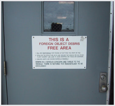 Photo of a sign reading "This is a foreign object debris free area."