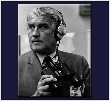 Older von Braun with headset & binocs