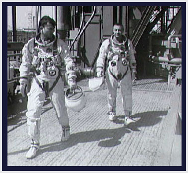 Astronauts Young and Grissom leaving launch pad